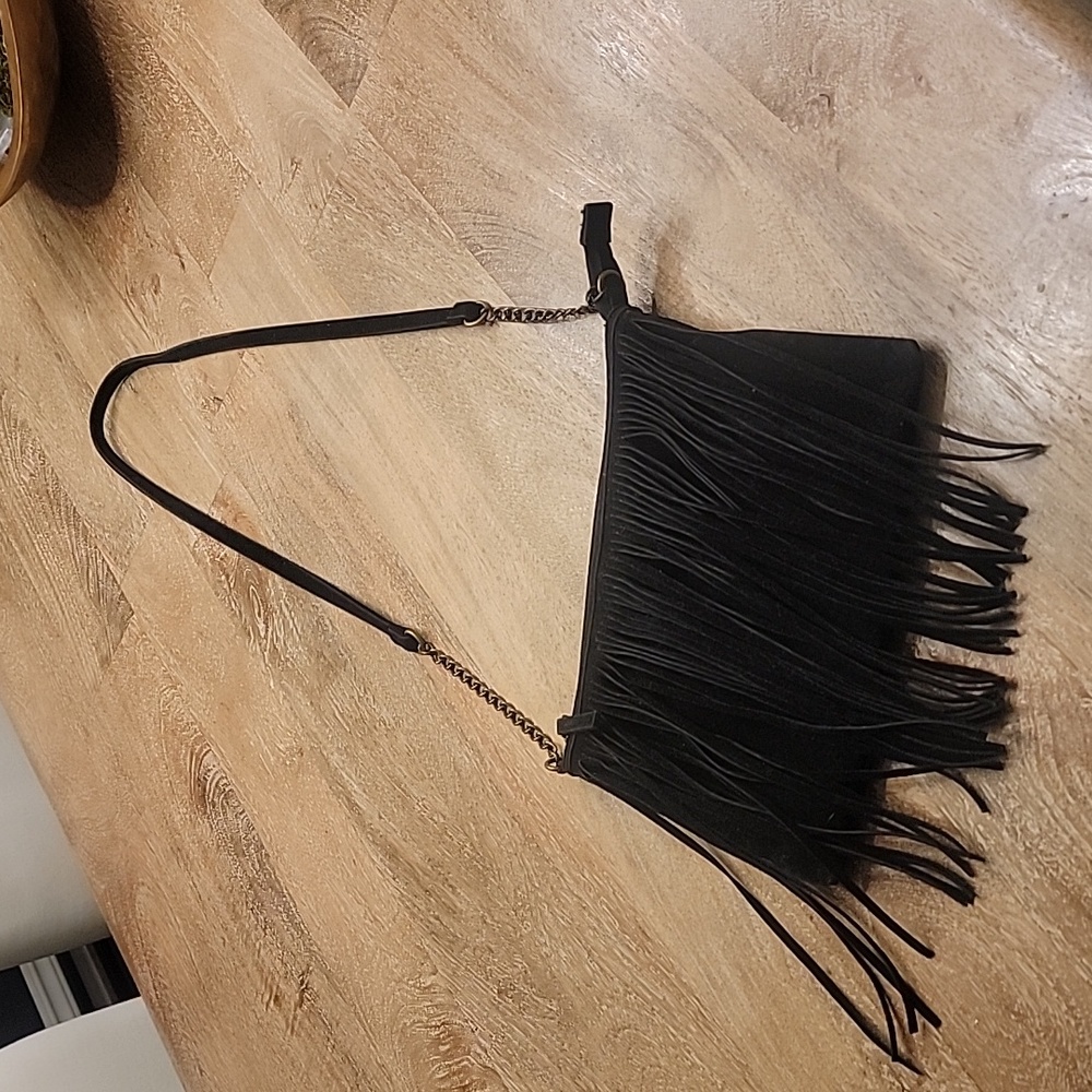 Cute, black, suede like fringe cross body purse.